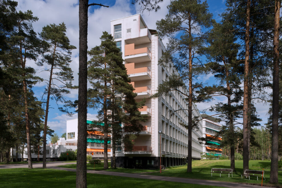 The white balcony wing of Paimio Sanatorium by Aino and Alvar Aalto among pines